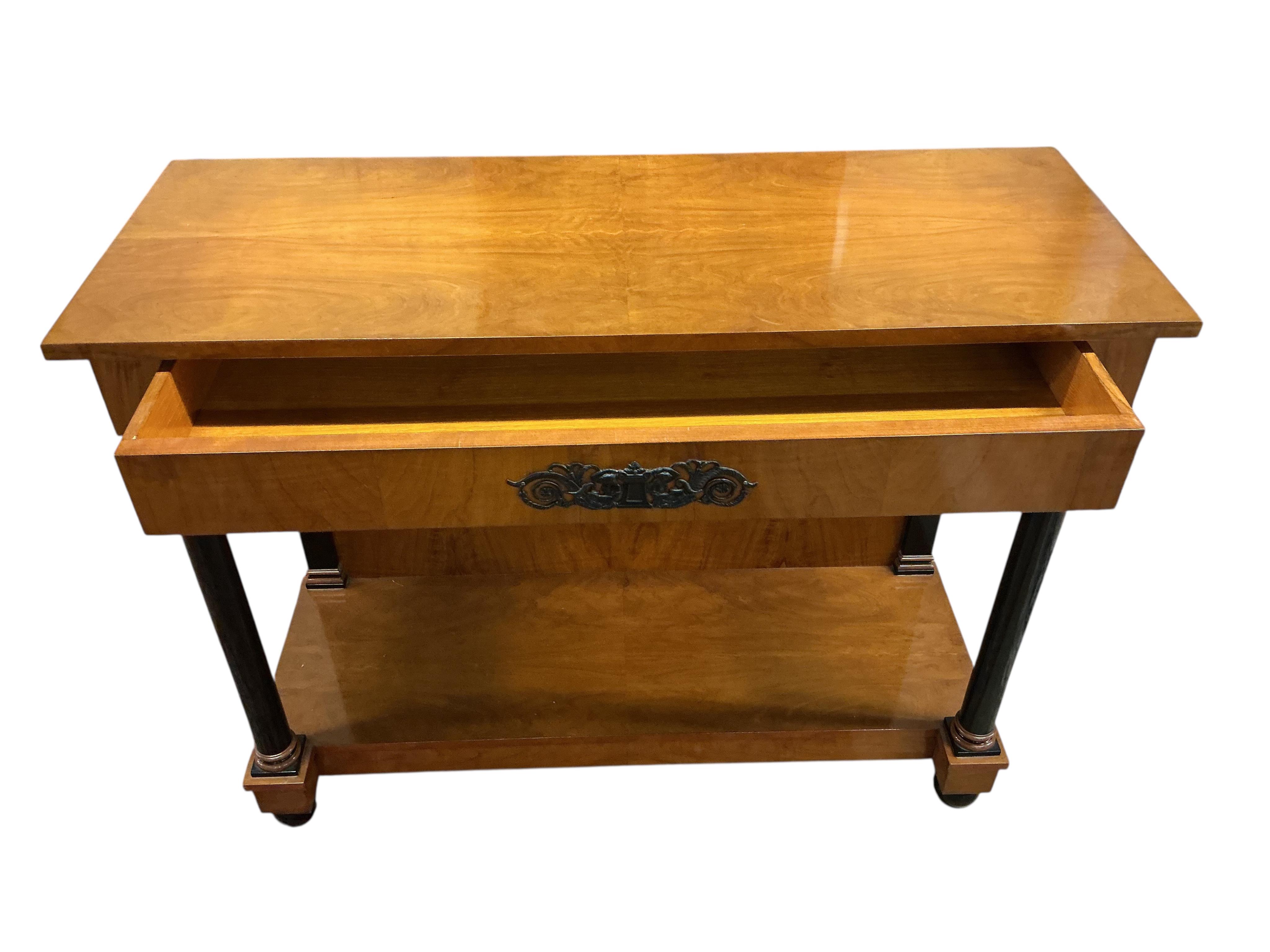 A pair of Biedermeier style cherry two tier console tables, with frieze drawers, width 110cm, depth 42cm, height 86cm
